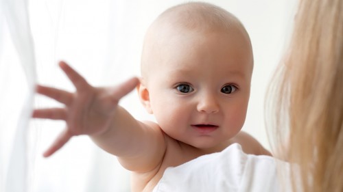 baby reaching baby reaching